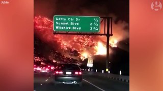 Commuter drives through raging wildfire in California – dashcam video