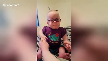 Baby is confused as she sees clearly for the first time