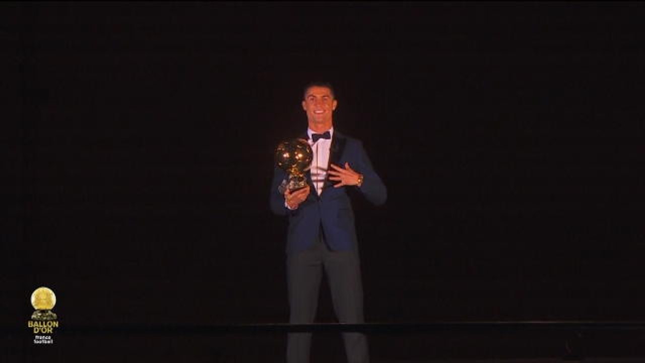 Cristiano Ronaldo lifts 2017 Ballon d'Or trophy atop Eiffel Tower