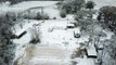 Drone Zooms In as Snowman Being Built in Louisiana