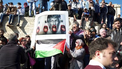 Palestinian protesters chant 'God is great' as Israeli forces arrive on horseback