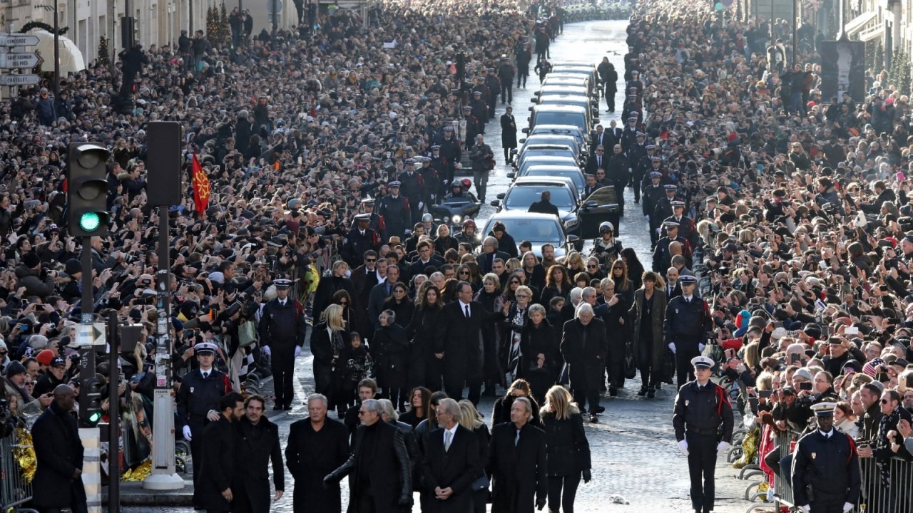 Thousands gather in Paris for French rock legend's funeral