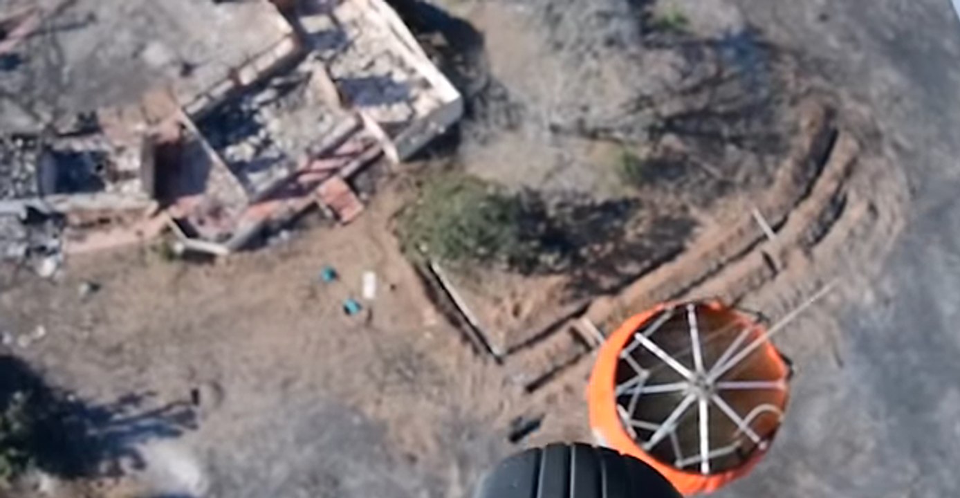 US Navy Helicopter Drops Water on California Wildfires