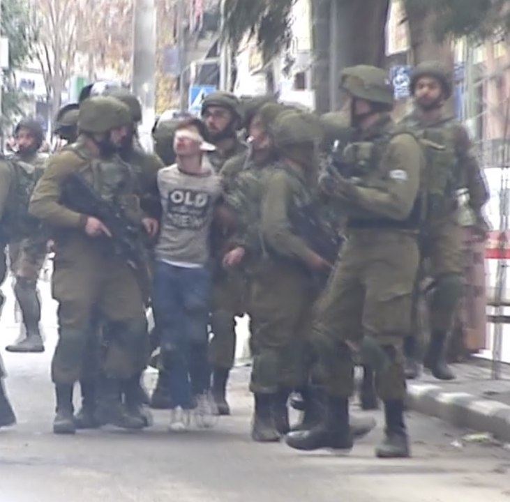 Blindfolded Boy Arrested by More than a Dozen Soldiers During Hebron During Protests