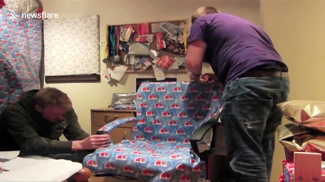 Friends wrap housemate's belongings in Christmas wrapping paper
