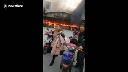 Worker cheats death after walking into ablaze factory to retrieve phone