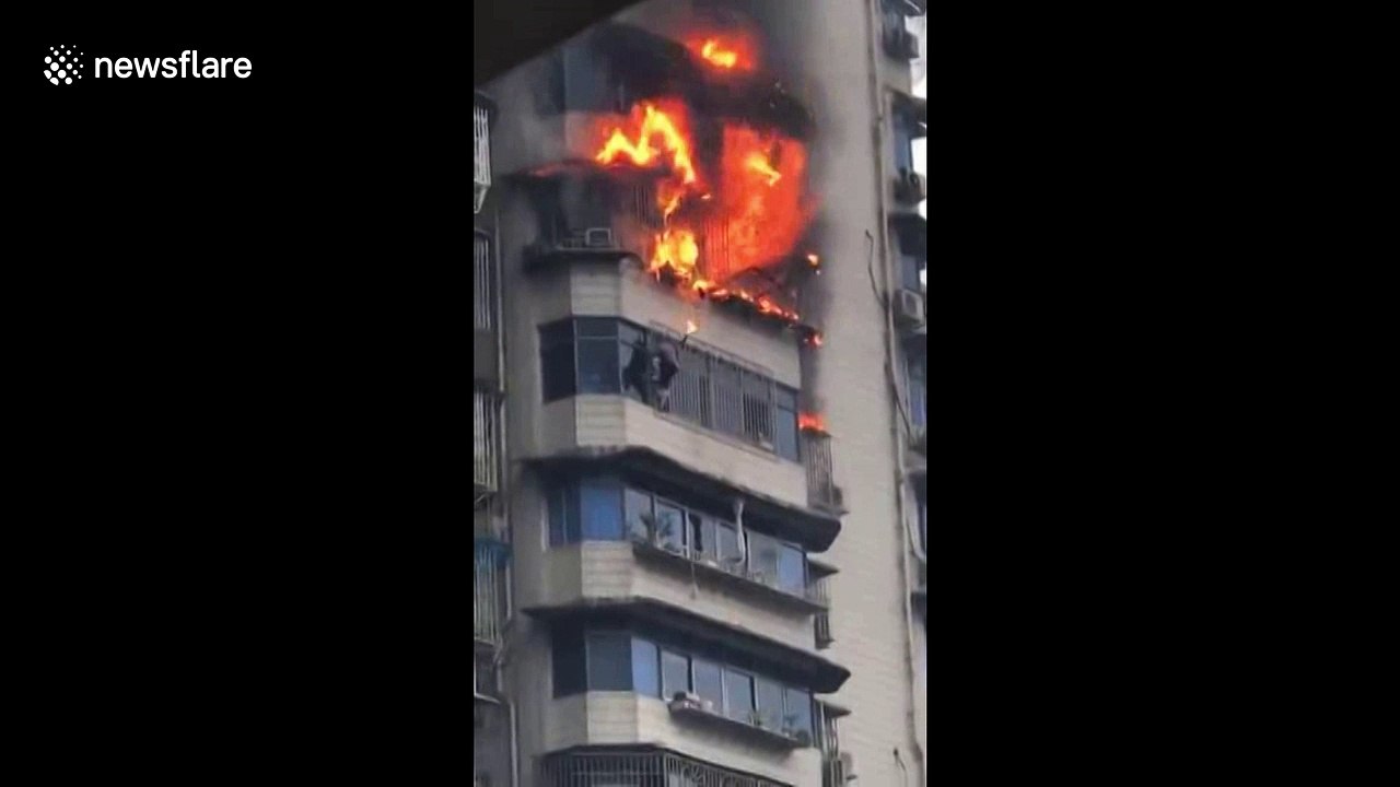 Man hangs out 23rd floor window after escaping from ablaze flat