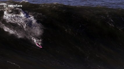 "Ghost Rider" charges a big wave in Nazaré, Portugal