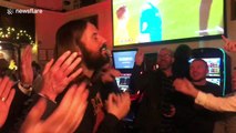 Football fans sing 'happy birthday' to Jesus lookalike