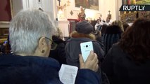 Father, Son and Holy SIRI? Italian Priest Blesses Mobile Phones at Mass