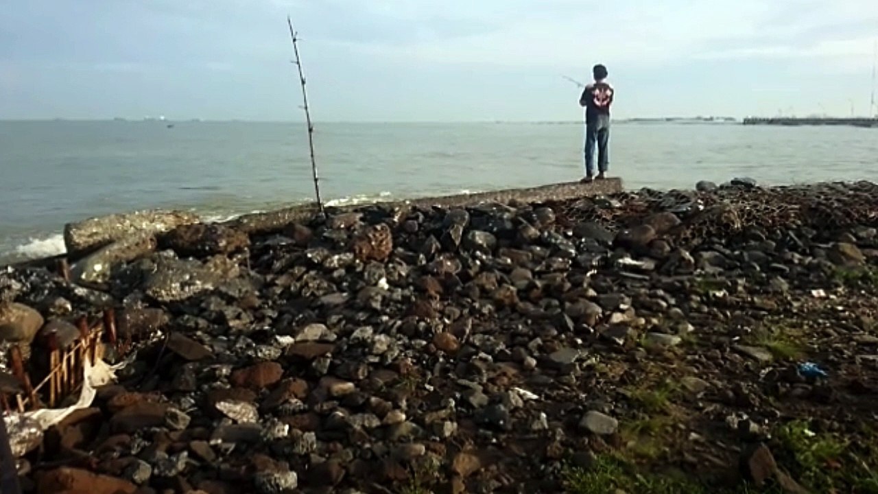 Just watching another angler, because the high waves