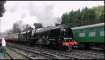 Steam Engine departing the Train Station pulling 8 Coaches