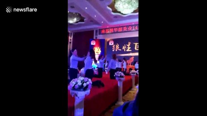 Beauty salon workers slap each other in team-building exercise