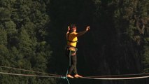 Watch blindfolded man break world record slacklining across Chinese canyon