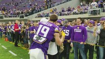 Adam Thielen kisses his wife and baby before game vs. Bengals