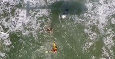 Swimmers Caught in Rip Hoisted to Safety by Rescue Helicopter