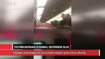 Uçağın arka kapısını hava almak için açtırmak isteyen yolcu kriz çıkardı