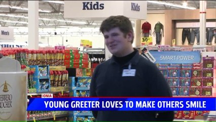 Enthusiastic Supermarket Greeter Puts a Smile on Customer`s Faces During the Holidays