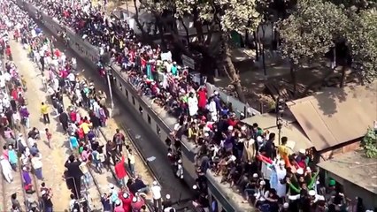 Thousands of people sit on the roof