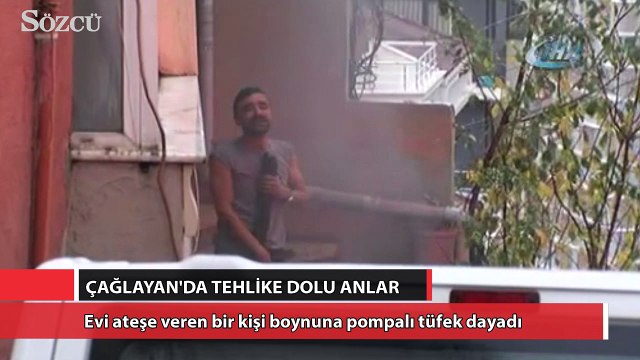 Evi ateşe veren bir genç boynuna pompalı tüfek dayadı
