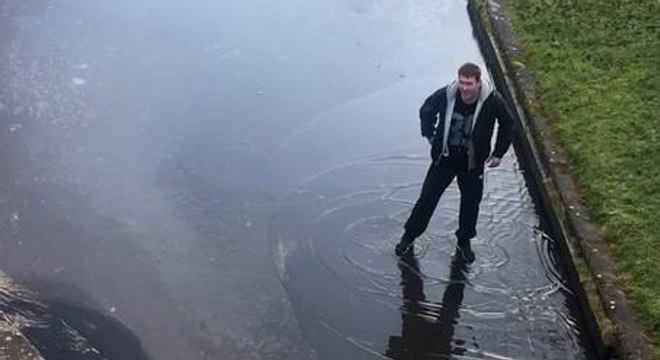 Guy Tries To Cross A Canal Covered By A Thin Layer Of Ice And Exactly What You'd Expect To Happen Happens