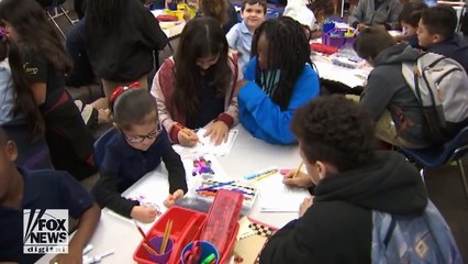 Students send holiday cards to the troops