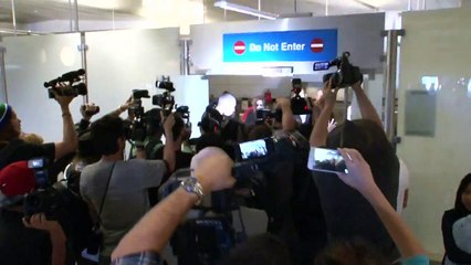 Kim Kardashian Gets Police Escort With Khloe At LAX [2014]