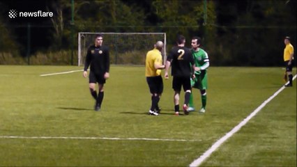Defender drags opponent off pitch by jersey's collar