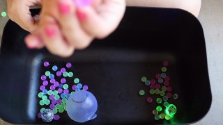 Cutting OPEN Squishy Balls! Slime Stress Ball - Stretchy Dinosaur - Glitter Water Ball