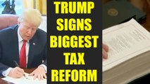 US President Donald Trump signs biggest tax reform to boost jobs, Watch | Oneindia News