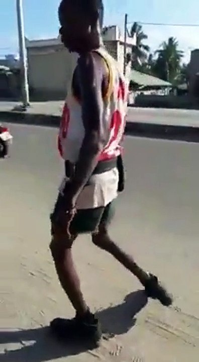 A drunken negro goes down the street
