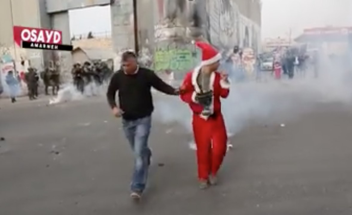 Israeli Army Fires at Protesters Dressed as Santa Claus in Bethlehem