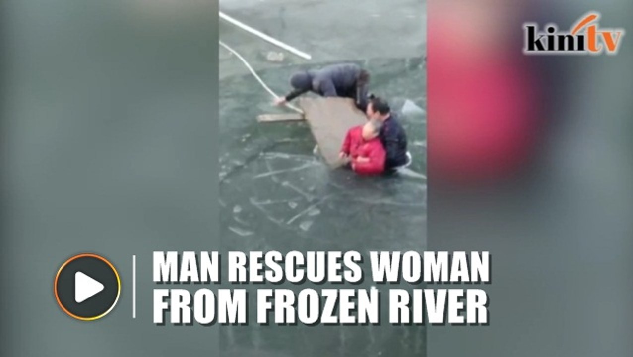 Man braves freezing river to rescue 70-year-old woman
