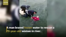 Buz tutmuş nehre düşen 70 yaşındaki kadını kurtarmaya çalışan koca yürekli adam