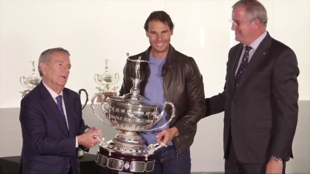 Rafael Nadal receives a silver replica of Conde de Godó Trophy from Barcelona Open