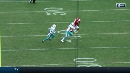 Demetrius Harris powers through three Dolphins for first down catch