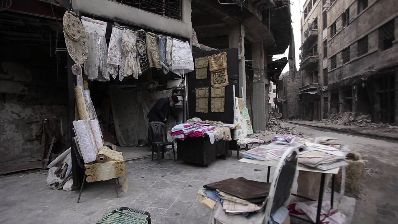 In rubble of Aleppo souk, tablecloth shop makes lonely comeback