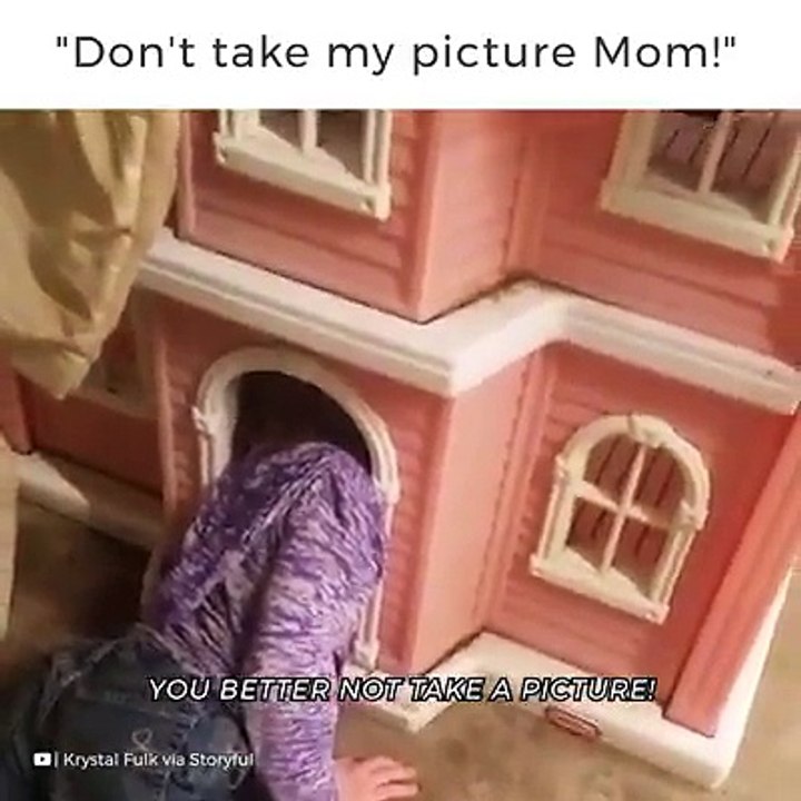 a cute girl getting inside doll house