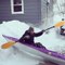 Woman Tries Kayaking Down Snowy Slope in Erie