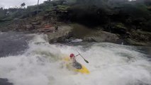 Kayaker catches football one-handed while riding 12ft waterfall