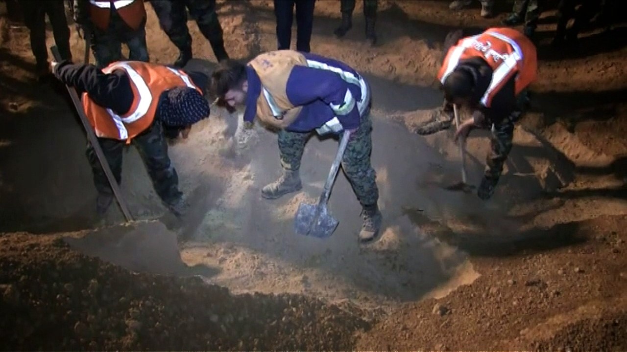 Two mass graves found in Raqa: Syrian state media