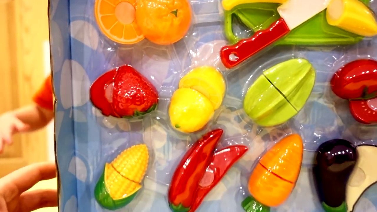 Max plays with toy fruits and vegetables