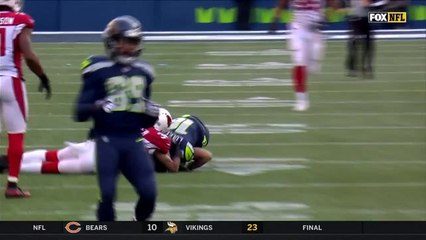 Wilson rips pass over the middle to Lockett for an 18-yard gain