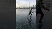 Smooth Skater Carves the Ice On Toronto's Frozen Inner Harbor