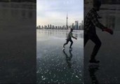 Smooth Skater Carves the Ice On Toronto's Frozen Inner Harbor