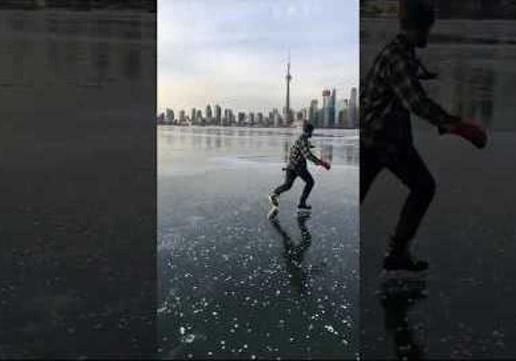 Smooth Skater Carves the Ice On Toronto's Frozen Inner Harbor