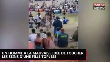 Un homme a la mauvaise idée de toucher les seins d'une fille topless (vidéo)