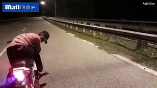 Phantom bike appears on carriageway in Malaysian city _ Daily Mail Online