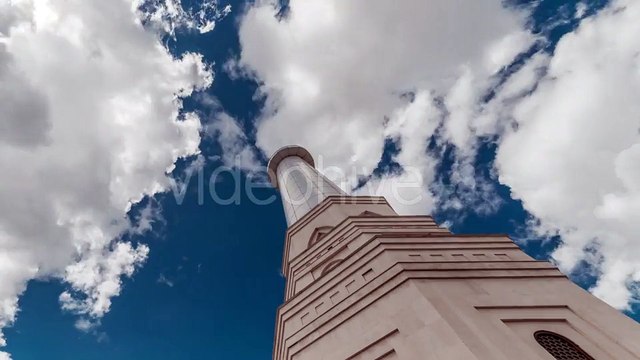 Blue Sky And Clouds Above The Peak Of The Tower Of White Mosque. Kazakhstan by Timelapse4K