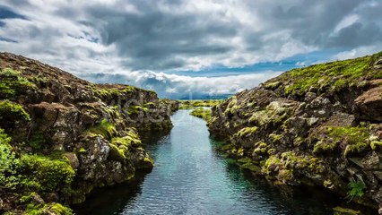 Penningagja Canyon With Cracks And Lava Formations, Water-filled by Timelapse4K